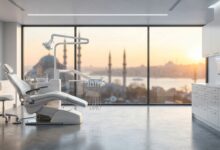 A pristine, modern dental clinic room featuring an advanced treatment chair, with a large window in the background showing a blurred, beautiful sunrise over the Istanbul, Turkey skyline. The scene signifies safe and high-quality dental tourism.