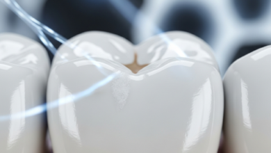A photorealistic, ultra-detailed macro close-up of a human molar tooth, displaying faint, chalky white spots on its clean enamel surface, indicative of early demineralization. The background is a softly blurred, abstract, and sterile scientific environment with cool, subtle lighting. The image conveys a clean, educational, and scientific aesthetic without any text.