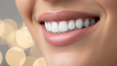 Close-up, photorealistic image of a person's radiant and healthy smile, featuring perfectly aligned, natural-looking teeth. The background is softly blurred.