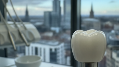 Close-up photorealistic image of a sterile dental implant with a white crown. The foreground is a blurred modern dental clinic, and the background shows a softly out-of-focus urban cityscape of Manchester.